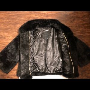 Ivanka Trump faux fur black and gold